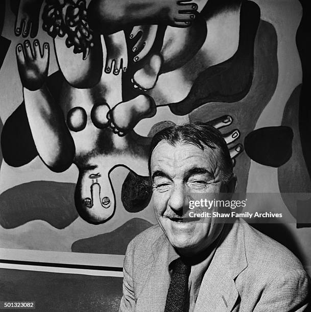 Fernand Leger in front of his painting "Plongeur Sur Fond Jaune" at the Museum of Modern Art in 1944 in New York, New York.