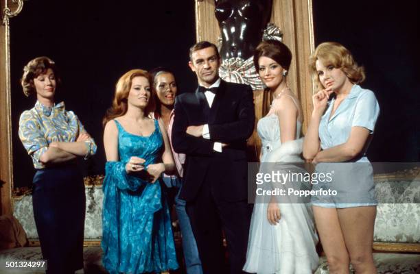Scottish actor Sean Connery posed with Lois Maxwell, Luciana Paluzzi, Martine Beswick, Claudine Auger and Molly Peters on the set of the James Bond...