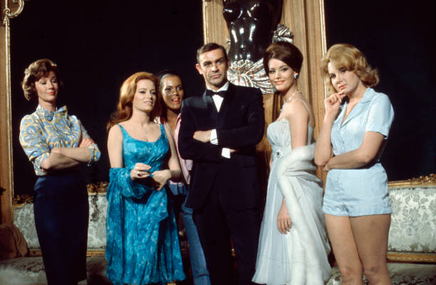 Scottish actor Sean Connery posed with Lois Maxwell, Luciana Paluzzi, Martine Beswick, Claudine Auger and Molly Peters on the set of the James Bond...