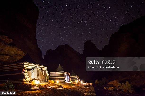 camping in the desert of wadi rum at night - jordan middle east stock pictures, royalty-free photos & images