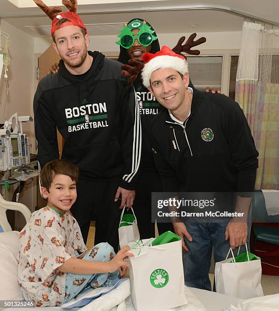 Boston Celtics David Lee, Jae Crowder, and head coach Brad Stevens visit with Charlie at Boston Children's Hospital December 14, 2015 in Boston,...