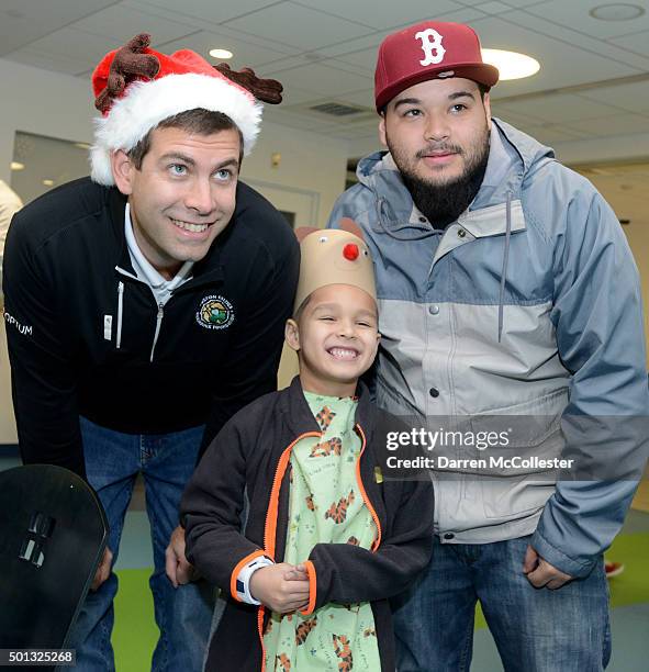 Boston Celtics head coach Brad Stevens visits with Jomar and Dad at Boston Children's Hospital December 14, 2015 in Boston, Massachusetts.