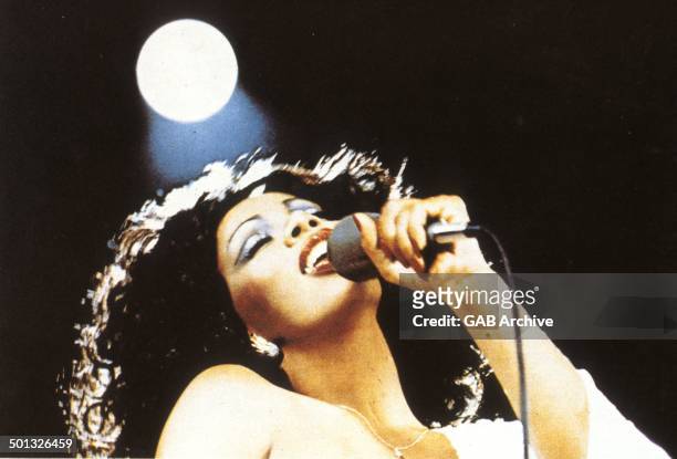 Donna Summer performs on stage, circa 1975.