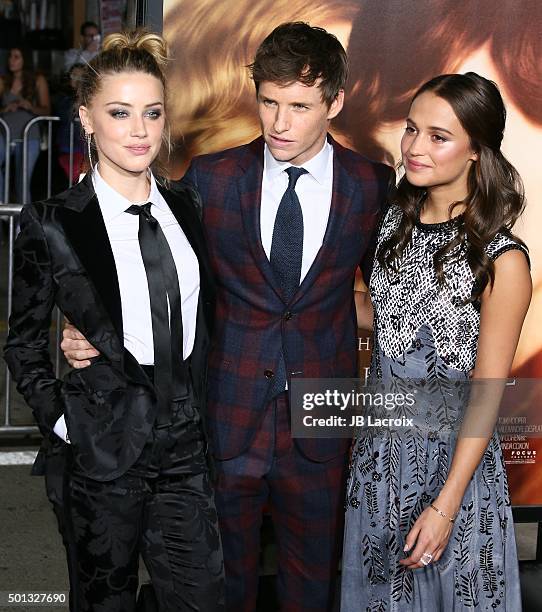 Amber Heard, Eddie Redmayne and Alicia Vikander attend the premiere of Focus Features' 'The Danish Girl' at Westwood Village Theatre on November 21,...