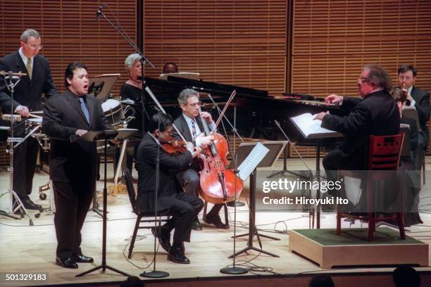 James Levine leading the Met Chamber Ensemble at Zankel Hall on Sunday night, February 22, 2004.This image:The baritone Earle Patriarco, left, with...