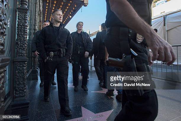 Police officers walk Hollywood Boulevard near El Capitan Theatre before the start of the premiere of Walt Disney Pictures And Lucasfilm's "Star Wars:...
