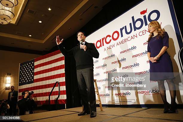 Senator Marco Rubio, a Republican from Florida and 2016 presidential candidate, center, speaks as his wife Jeanette Dousdebes looks on during a...