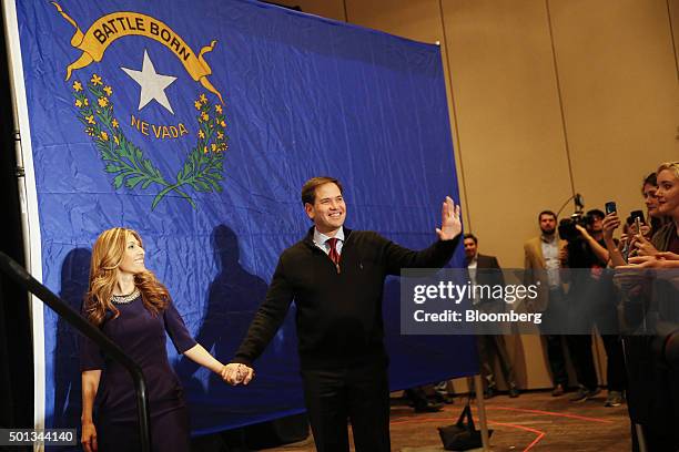 Senator Marco Rubio, a Republican from Florida and 2016 presidential candidate, center, and his wife Jeanette Dousdebes, left, greet attendees during...