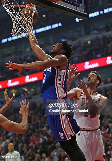 Jahlil Okafor of the Philadelphia 76ers goes up for a shot past Pau Gasol of the Chicago Bulls at the United Center on December 14, 2015 in Chicago,...