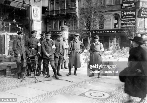 Armed insurgency of supporters of the German Communist Party against the government in Berlin : sentry of troups loyal to the government on a street...