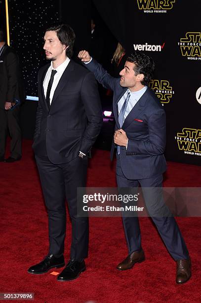 Actor Adam Driver is photobombed by actor Oscar Isaac as they attend the premiere of Walt Disney Pictures and Lucasfilm's "Star Wars: The Force...