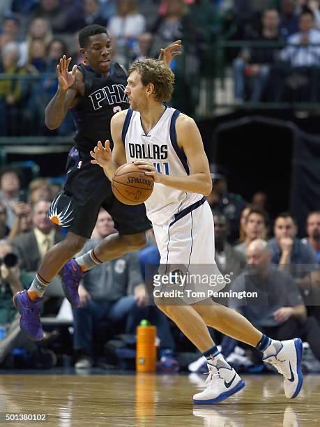 Dirk Nowitzki of the Dallas Mavericks drives to the basket against Eric Bledsoe of the Phoenix Suns in the second half at American Airlines Center on...