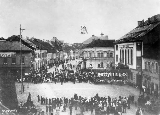 Tightrope dancers during a performance on a square in a small town in Middle Europe - around 1910