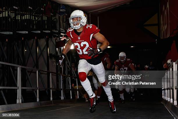 Free safety Tyrann Mathieu of the Arizona Cardinals runs out onto the field before the NFL game against the Minnesota Vikings at the University of...