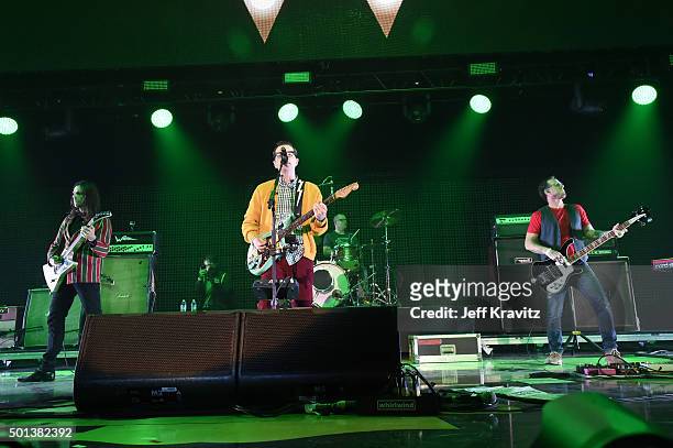 Musicians Brian Bell, Rivers Cuomo, Patrick Wilson and Scott Shriner perform onstage during 106.7 KROQ Almost Acoustic Christmas 2015 at The Forum on...
