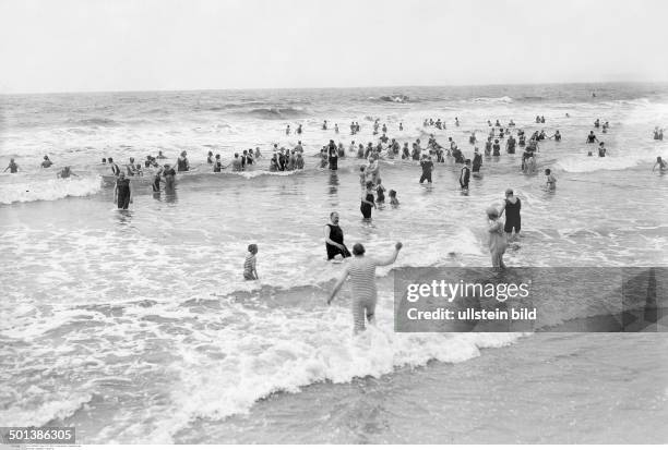 Norderney island, North Sea: people taking a bath in the sea - in the 1910s