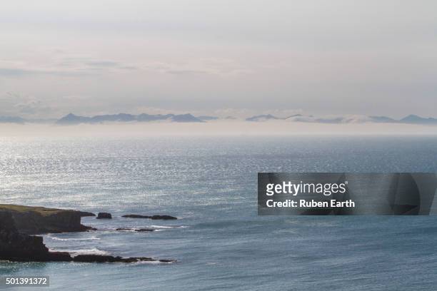 view of the north iceland mountains and sea from grimsey island - icelands grimsey island photos et images de collection
