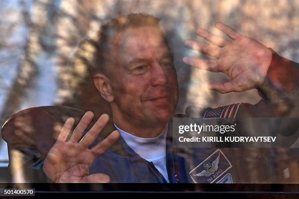 Tim Koopstra US astronaut Tim Kopra waves from a bus during a sending-off ceremony ...