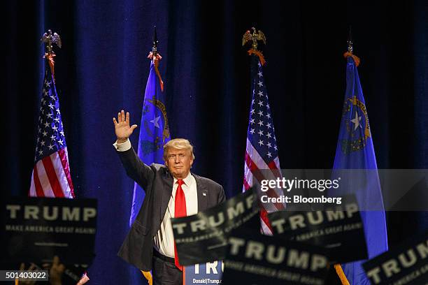 Donald Trump, president and chief executive officer of Trump Organization Inc. And 2016 Republican presidential candidate, waves as he walks off...