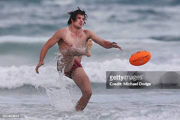 Dylan Buckley kicks the ball while participating in a recovery session a the beach during the Carlton Blues AFL pre-season training camp on December...