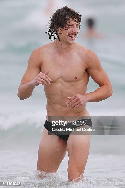Mark Whiley reacts while participating in a recovery session at the beach during the Carlton Blues AFL pre-season training camp on December 15, 2015...