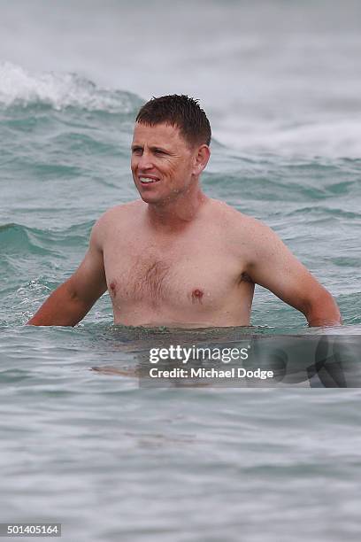 Head Coach Brendon Bolton joins in on a recovery session a the beach during the Carlton Blues AFL pre-season training camp on December 15, 2015 in...