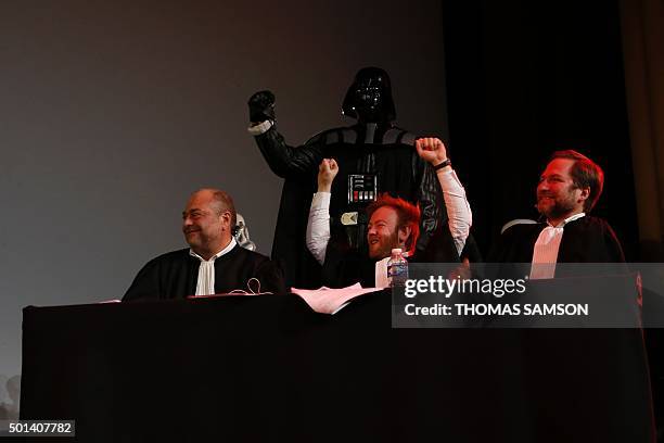 French lawyers Eric Dupond-Moretti, Antoine Vey and Patrice Spinosi sit next to a person wearing a Darth Vader costume during the "Darth Vader's...