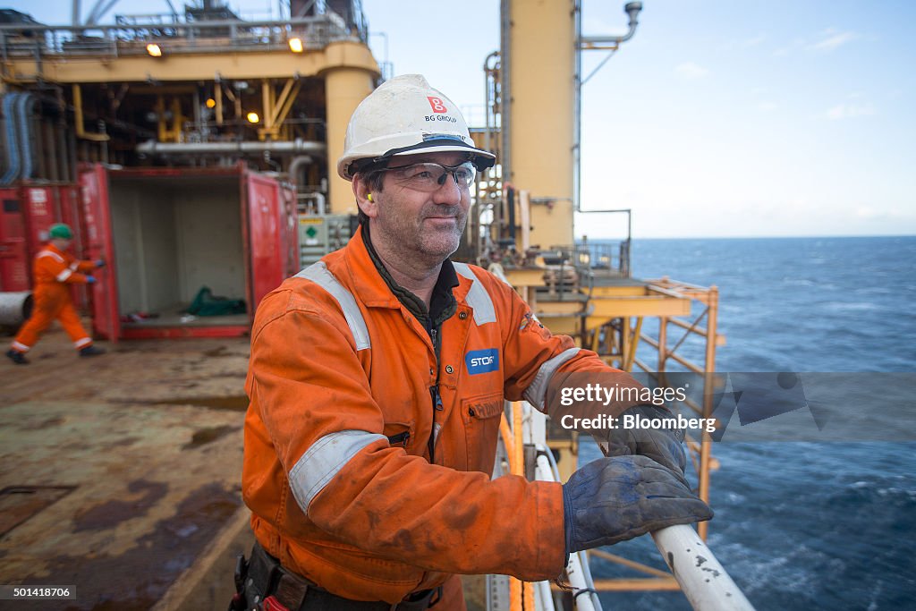 Armada Rig A worker looks out to the sea from the weather deck of the Armada gas ...