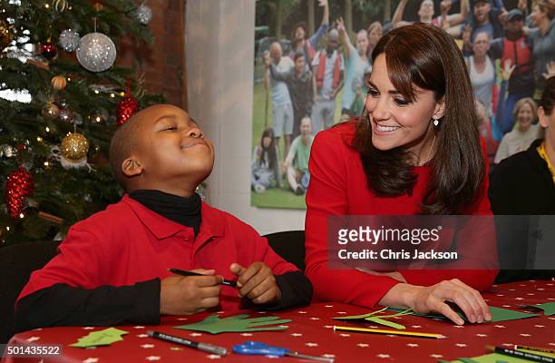 Catherine, Duchess of Cambridge takes part in group activities as she attends the Anna Freud Centre Family School Christmas Party at Anna Freud...