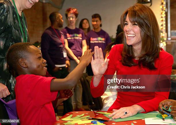 Catherine, Duchess of Cambridge takes part in group activities as she attends the Anna Freud Centre Family School Christmas Party at Anna Freud...