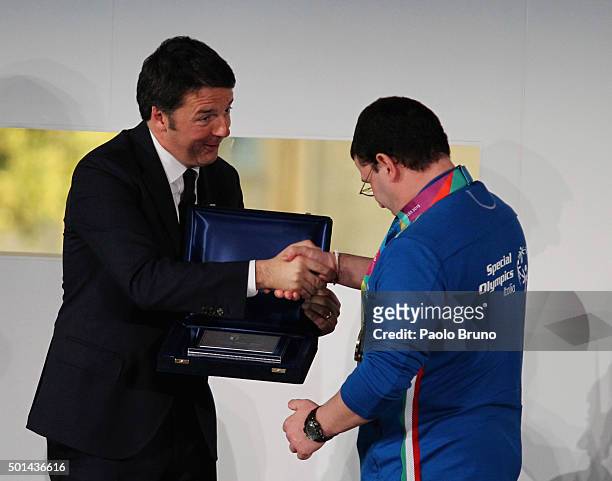 Italian Prime Minister Matteo Renzi shakes the hands with an athlete during the Italian Olympic Commitee 'Collari d'Oro' Awards ceremony on December...