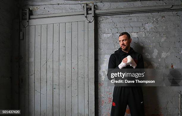Boxer Andy Lee poses for a photograph prior to a media work-out at Arnie's Gym on December 15, 2015 in Manchester, England. Lee defends his World...