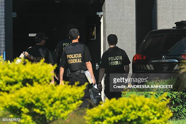 Federal Police personnel raid the offices of the president of the Brazilian chamber of deputies Eduardo Cunha in Brasilia, on December 15, 2015....