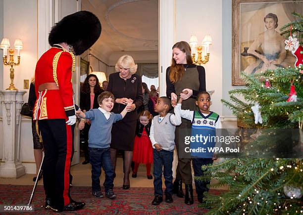 Orr Bar-On, Kiera Holland 5 and twins Adam and Aten Ndaka 5 join Camilla, Duchess of Cornwall, patron of the Helen & Douglas House and The London...