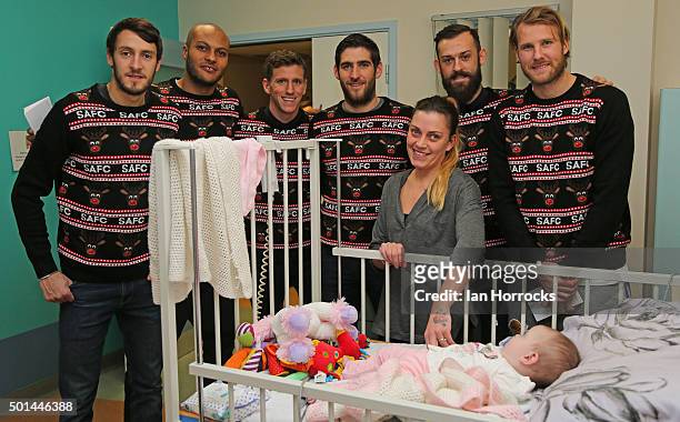 Sunderland players meet Lyndsey Ramage and daughter Billie on the children wards at Durham University Hospital on December 15, 2015 in Sunderland,...