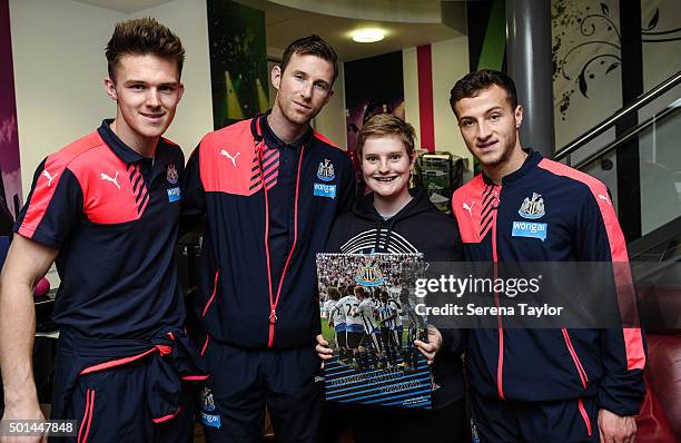 Newcastle Players seen L-R Freddie Woodman, Mike Williamson and Jamie Sterry pose for a photo after giving presents to a poorly child during...