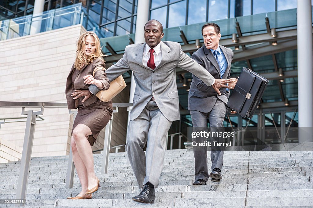 Three Business People Racing to See Who Will be First
