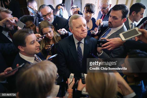 Senate Minority Whip Richard Durbin is surrounded by reporters following the weekly Democratic policy luncheon at the U.S. Capitol December 15, 2015...