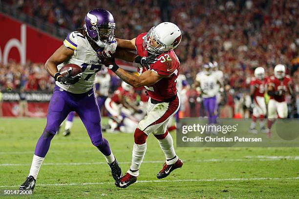 Wide receiver Jarius Wright of the Minnesota Vikings is tackled by free safety Tyrann Mathieu of the Arizona Cardinals after a reception during the...