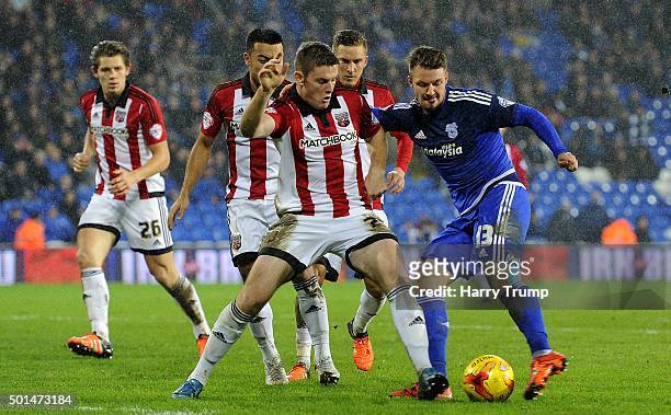 Anthony Pilkington of Cardiff City is tackled by Jack O'Connell of Brentford during the Sky Bet Championship match between Cardiff City and Brentford...