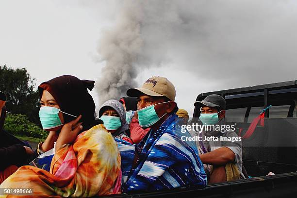 Local villagers wearing a masker while mount Bromo spewing volcanic ash material during eruption in the national park on December 15, 2015 in...