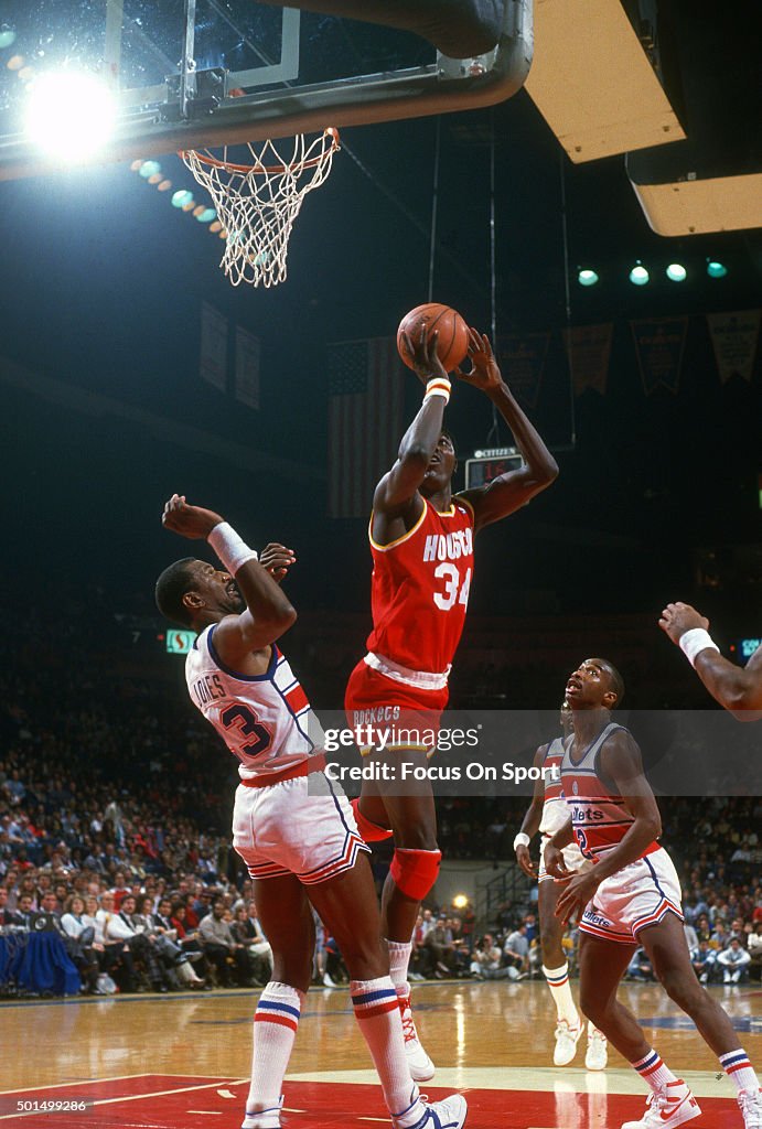 Jones Houston Rockets Hakeem Olajuwon of the Houston Rockets shoots over Charles Jones of ...