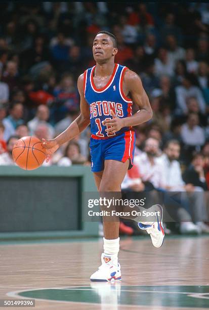 Isiah Thomas of the Detroit Pistons dribbles the ball up court against the Milwaukee Bucks during an NBA basketball game circa 1987 at the MECCA...