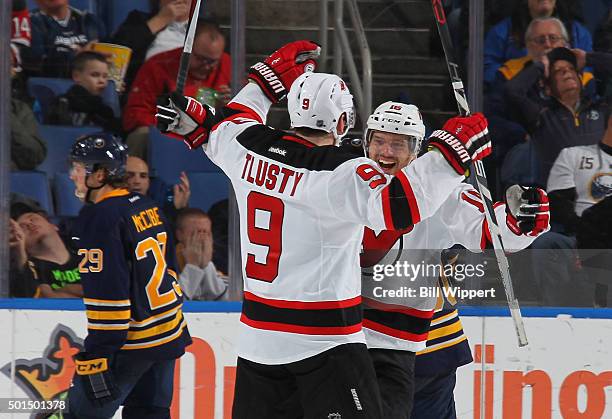 Jiri Tlusty of the New Jersey Devils celebrates his third period goal with Jacob Josefson during their 2-0 victory against the Buffalo Sabres in an...