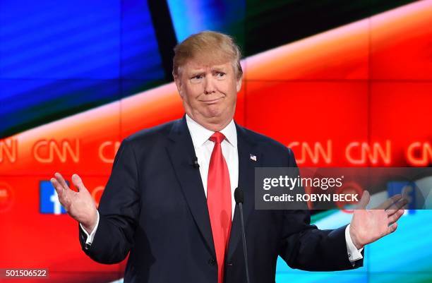 Republican presidential candidate businessman Donald Trump gestures during the Republican Presidential Debate, hosted by CNN, at The Venetian Las...