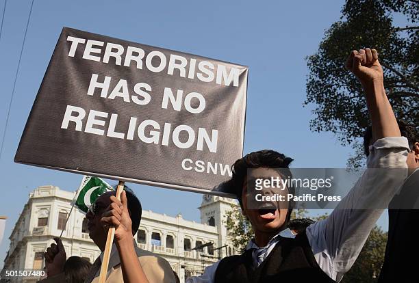 Pakistani student shouts and brings placard during a rally to pay tribute to the victims of the Peshawar school massacre of December 16 the deadliest...