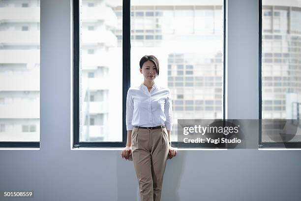 portrait of confident businesswoman - white pants bildbanksfoton och bilder