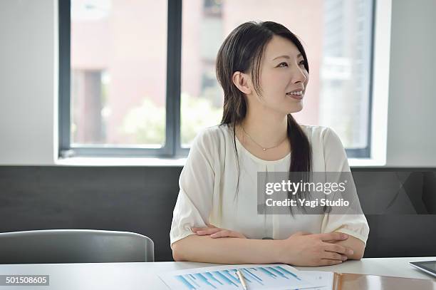 businesswoman working in meeting room - business woman blouse stock-fotos und bilder