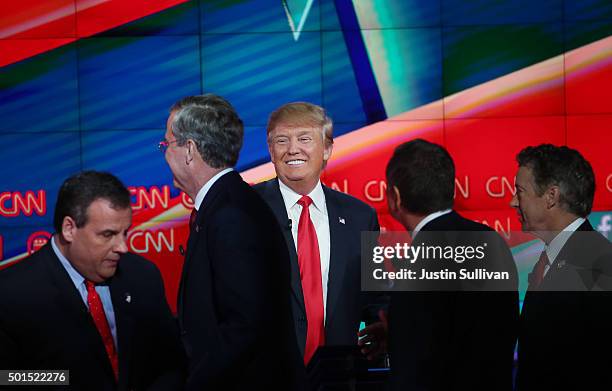 Republican presidential candidate Donald Trump smiles as New Jersey Gov. Chris Christie , Jeb Bush , Ohio Gov. John Kasich and U.S. Sen. Rand Paul...