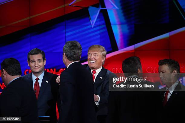 Republican presidential candidate Donald Trump smiles as New Jersey Gov. Chris Christie , Jeb Bush , Ohio Gov. John Kasich and U.S. Sen. Rand Paul...